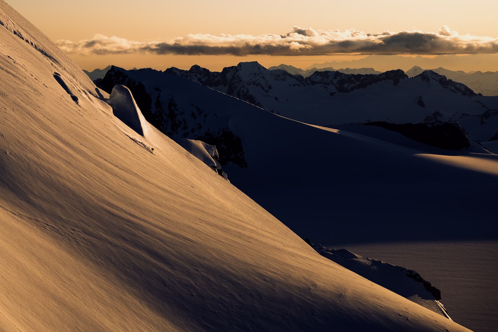 Mountain terrain and ski runs in backcountry setting